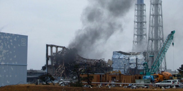 March 21: In this photo released by Tokyo Electric Power Co. (TEPCO), gray smoke rises from Unit 3 of the tsunami-stricken Fukushima Dai-ichi nuclear power plant in Okumamachi, Fukushima Prefecture, Japan.