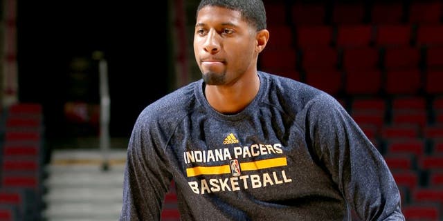 CHICAGO, IL - MARCH 18: Paul George #13 of the Indiana Pacers warms up before a game against the Chicago Bulls on March 18, 2015 at the United Center in Chicago, Illinois. NOTE TO USER: User expressly acknowledges and agrees that, by downloading and or using this Photograph, user is consenting to the terms and conditions of the Getty Images License Agreement. Mandatory Copyright Notice: Copyright 2015 NBAE (Photo by Joe Murphy/NBAE via Getty Images)