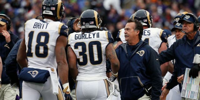 BALTIMORE, MD - NOVEMBER 22: Running back Todd Gurley #30 of the St. Louis Rams celebrates after scoring a first quarter touchdown against the Baltimore Ravens with wide receiver Kenny Britt #18 of the St. Louis Rams and head coach Jeff Fisher of the St. Louis Rams at M&T Bank Stadium on November 22, 2015 in Baltimore, Maryland. (Photo by Rob Carr/Getty Images)