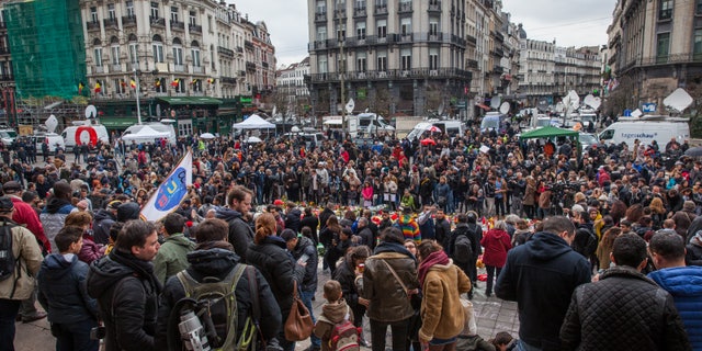 Crowds gather in the wake of the Belgium terror attacks for a public memorial.