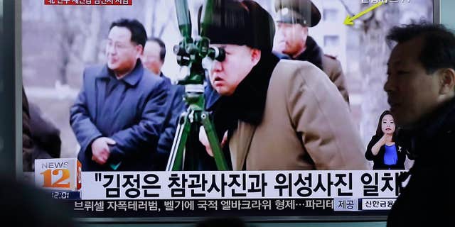 March 24, 2016: A man passes by a TV screen showing North Korean leader Kim Jong Un during a news program at Seoul Railway Station in Seoul, South Korea.