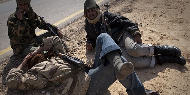 March 24: Libyan rebels take a rest on a checkpoint on the frontline near Zwitina, the outskirts of the city of Ajdabiya, south of Benghazi, eastern Libya.