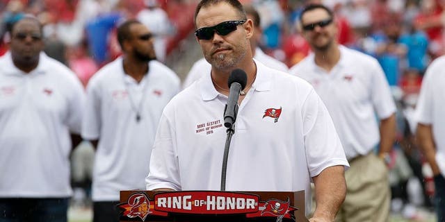 TAMPA, FL - OCTOBER 4: Former Runningback Mike Alstott of the Tampa Bay Buccaneers adresses the fans as he is being honored by being placed in the Ring of Honor during halftime against the Carolina Panthers at Raymond James Stadium on October 4, 2015 in Tampa, Florida. Alstott played his entire 12 year career with the Buccaneers from 1996 to 2007. Panthers defeated the Buccaneers 37 to 23. (Photo by Don Juan Moore/Getty Images)