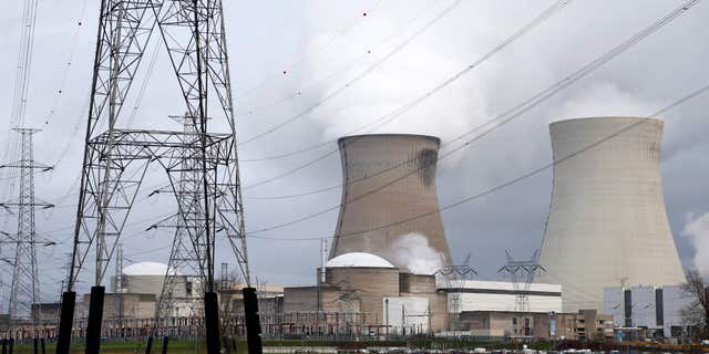 Jan. 4, 2016: High-voltage power lines are seen next to cooling towers of Doel's nuclear plant of Electrabel, the Belgian unit of French company Engie, former GDF Suez, in Doel near Antwerp, Belgium