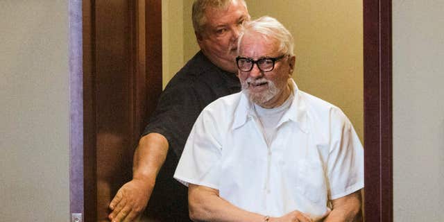 FILE - In this Jan. 14, 2016 file photo, convicted murderer Jack McCullough walks into the DeKalb County Courthouse in Sycamore, Ill., to request post-conviction relief.