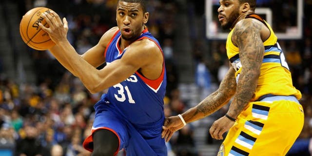 Mar 25, 2015; Denver, CO, USA; Philadelphia 76ers guard Hollis Thompson (31) drives to the basket past Denver Nuggets guard Jameer Nelson (28) during the second half at Pepsi Center. The 76ers won 99-85. Mandatory Credit: Chris Humphreys-USA TODAY Sports