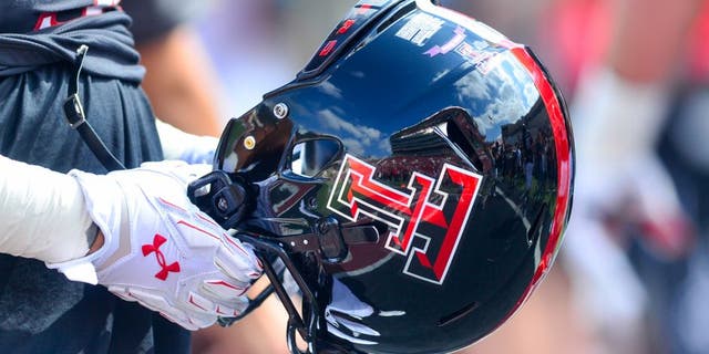 LUBBOCK, TX - OCTOBER 10: A Texas Tech Red Raider player holds a helmet before the game against the Iowa State Cyclones on October 10, 2015 at Jones AT&T Stadium in Lubbock, Texas. Texas Tech won the game 66-31. (Photo by John Weast/Getty Images)