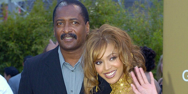 Beyonce Knowles (L) arrives at the 46th Annual Grammy Awards with her father and manager Mathew Knowles in Los Angeles.