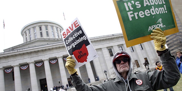 March 29: Tom Fagan, of Dayton, protests against Senate Bill 5 at the Ohio statehouse in Columbus, Ohio.