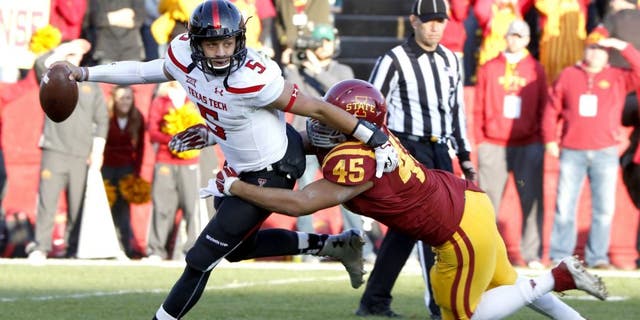 AMES, IA - NOVEMBER 22: Quarterback Patrick Mahomes #5 of the Texas Tech Red Raiders is tackled by defensive end Dale Pierson #45 of the Iowa State Cyclones in the first half of play at Jack Trice Stadium on November 22, 2014 in Ames, Iowa. (Photo by David K Purdy/Getty Images)