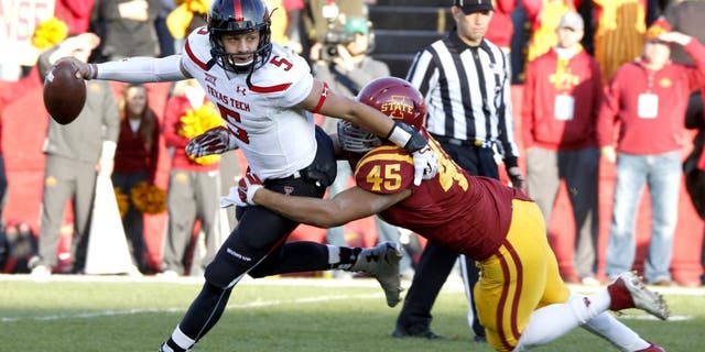 AMES, IA - NOVEMBER 22: Quarterback Patrick Mahomes #5 of the Texas Tech Red Raiders is tackled by defensive end Dale Pierson #45 of the Iowa State Cyclones in the first half of play at Jack Trice Stadium on November 22, 2014 in Ames, Iowa. (Photo by David K Purdy/Getty Images)