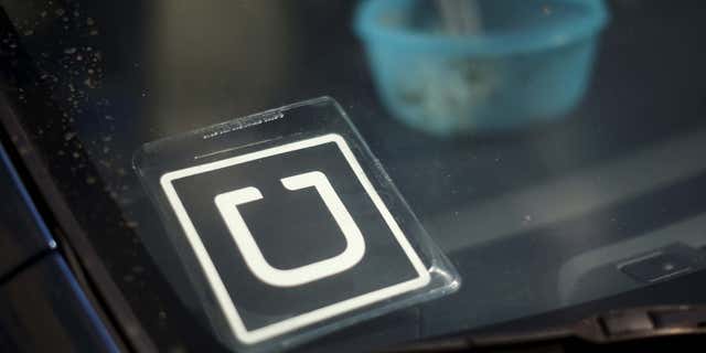 July 15, 2015: An Uber car is seen parked with the driver's lunch left on the dashboard in Venice, Los Angeles.