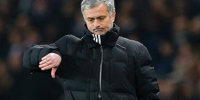 Chelsea manager Jose Mourinho gestures during the Champions League round of 16 first leg soccer match between Paris Saint Germain and Chelsea at the Parc des Princes stadium in Paris, France, Tuesday, Feb. 17, 2015. (AP Photo/Christophe Ena)