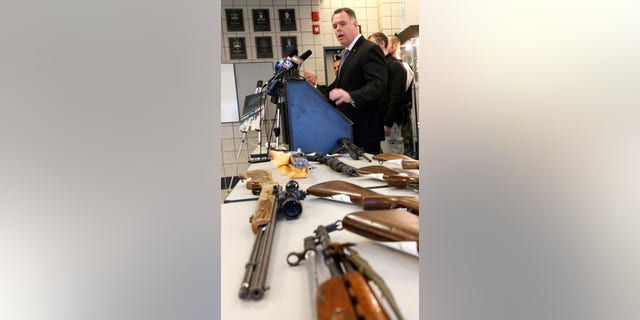 Chicago Police Superintendent Garry McCarthy stands near guns confiscated in Chicago and talks about the department's efforts to curb gun violence during a news conference Monday, Feb. 4, 2013, in Chicago. Police say they are receiving many tips as they investigate last week's shooting death of a 15-year-old Hadiya Pendleton. But there is also a concern that people with valuable information may not be coming forward and others wonder if people are staying silent out of concern that talking might put their own lives in danger. (AP Photo/Charles Rex Arbogast)