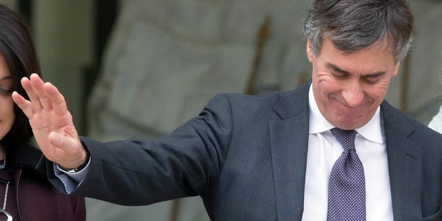 France's Budget Minister Jerome Cahuzac, reacts to journalists questions, as he leaves the weekly cabinet meeting at the Elysee Palace in Paris, Wednesday, Jan. 9, 2013. The Paris prosecutors office says it is opening a preliminary investigation into allegations that France's budget minister hid money from French tax authorities in offshore accounts. A statement Tuesday from the prosecutors office said it also intends to open a probe for defamation based on a complaint over the allegations filed by Budget Minister Jerome Cahuzac. (AP Photo/Michel Euler)