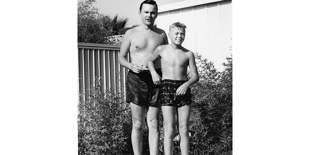 Bob and Robert Crane at home pool, Tarzana, 1960.