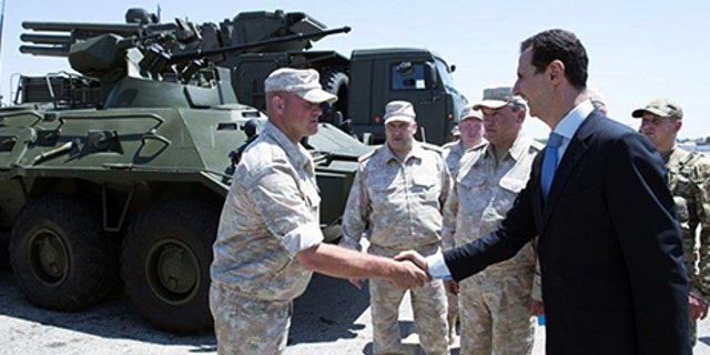 Syria's President Bashar al-Assad visits a Russian air base at Hmeymim, in western Syria in this handout picture posted on SANA on June 27, 2017, Syria. SANA/Handout via REUTERS ATTENTION EDITORS - THIS PICTURE WAS PROVIDED BY A THIRD PARTY. REUTERS IS UNABLE TO INDEPENDENTLY VERIFY THE AUTHENTICITY, CONTENT, LOCATION OR DATE OF THIS IMAGE - RTS18TY5