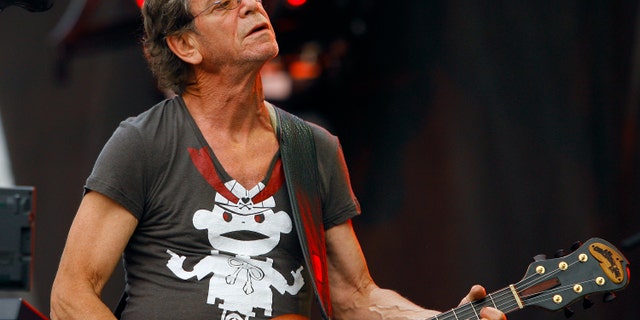 FILE - In this Sunday, Aug. 9, 2009 file photo, Lou Reed performs at the Lollapalooza music festival, in Chicago. Punk-poet, rock legend Lou Reed is dead of a liver-related ailment, his literary agen said Sunday, Oct. 27, 2013. He was 71. (AP Photo/John Smierciak, File)