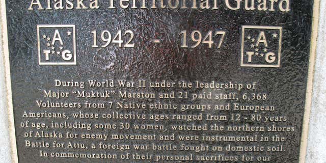 FILE - This Thursday, April 26, 2012, file photo in Anchorage, Alaska, a plaque at the base of a bronze statue commemorates the Alaska Territorial Guard, a pre-statehood militia formed to protect the vast territory from the threat of Japanese aggression during World War II.