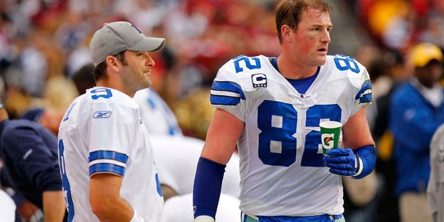 November 20, 2011; Landover, MD, USA; Dallas Cowboys quarterback Tony Romo (9) talks with Cowboys tight end Jason Witten (82) on the sidelines against the Washington Redskins at FedEx Field. Mandatory Credit: Geoff Burke-USA TODAY Sports