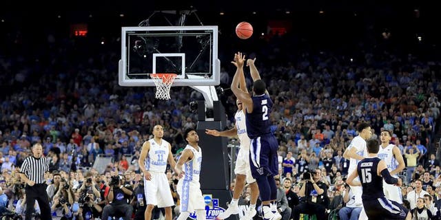 HOUSTON, TEXAS - APRIL 04: Kris Jenkins #2 of the Villanova Wildcats shoots the game-winning three pointer to defeat the North Carolina Tar Heels 77-74 in the 2016 NCAA Men's Final Four National Championship game at NRG Stadium on April 4, 2016 in Houston, Texas. (Photo by Ronald Martinez/Getty Images)