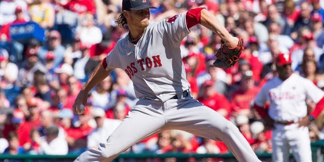 Apr 6, 2015; Philadelphia, PA, USA; Boston Red Sox starting pitcher Clay Buchholz (11) pitches against the Philadelphia Phillies during the first inning on opening day at Citizens bank Park. Mandatory Credit: Bill Streicher-USA TODAY Sports