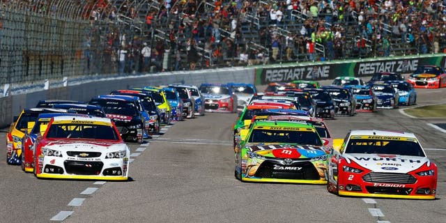 FORT WORTH, TX - NOVEMBER 08: Brad Keselowski, driver of the #2 Wurth Ford, leads the field past the green flag to start the NASCAR Sprint Cup Series AAA Texas 500 at Texas Motor Speedway on November 8, 2015 in Fort Worth, Texas. (Photo by Jonathan Ferrey/Getty Images for Texas Motor Speedway)
