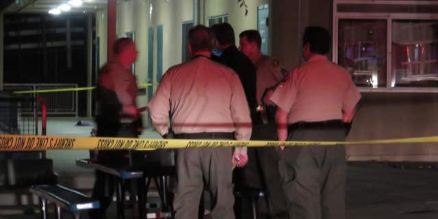 This Monday, April, 4, 2016 photo provided by Safety For Citizens shows sheriffs officials on the scene after a homemade model rocket exploded at Madrona Elementary School in Thousand Oaks, Calif.