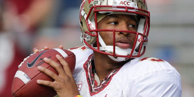 FILE - In this Nov. 30, 2013, file photo, Florida State quarterback Jameis Winston warms up before an NCAA college football game against Florida in Gainesville, Fla. The prosecutor overseeing the investigation of sexual assault allegations against Winston says it is completed. State Attorney Willie Meggs has scheduled a news conference at 2 p.m. Thursday, Dec. 5, 2013, in his office to announce his findings. (AP Photo/John Raoux, File)