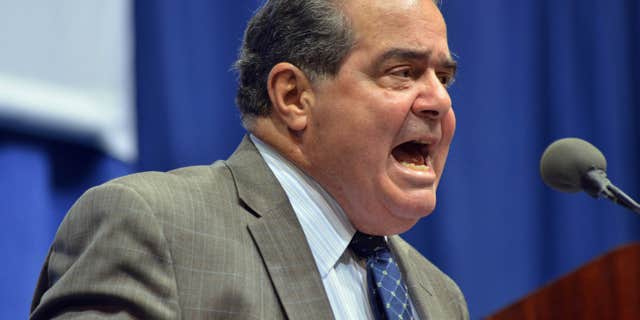FILE - In this Oct. 2, 2013 file photo, Supreme Court Justice Antonin Scalia speaks at Tufts University in Medford, Mass.