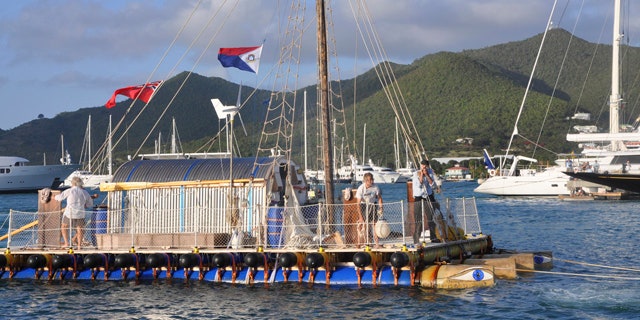 April 6: Eighty five-year-old British sailor Anthony Smith, right, captains the An-Tiki, a 40-foot sail-powered raft, as he and crew complete their roughly two month, transatlantic voyage, arriving into Philipsburg, St. Maarten.