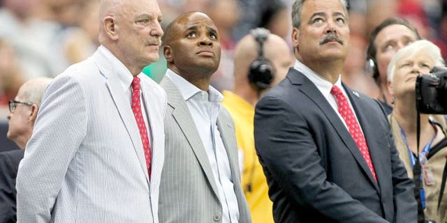 Aug 16, 2014; Houston, TX, USA; Houston Texans owner Bob McNair (left) and general manager Rick Smith (middle) and chief operating officer Cal McNair (right) watch during the first quarter against the Atlanta Falcons at NRG Stadium. Mandatory Credit: Troy Taormina-USA TODAY Sports