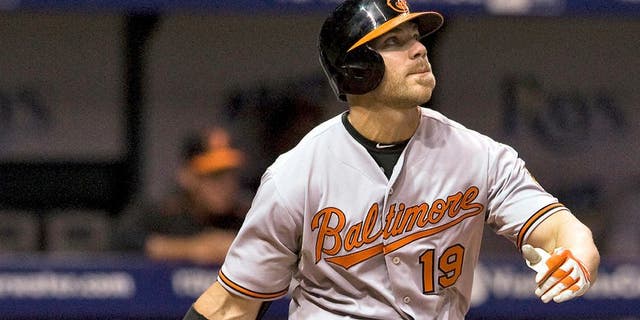 Baltimore Orioles designated hitter Chris Davis flies out to right field during the eighth inning of a baseball game against the Tampa Bay Rays, Tuesday, April 7, 2015, in St. Petersburg, Fla. Davis was hitless in his first game since he was reinstated from the restricted list earlier Tuesday. Davis was suspended 25 games by MLB on Sept. 12 for testing positive for an amphetamine. (AP Photo/Steve Nesius)