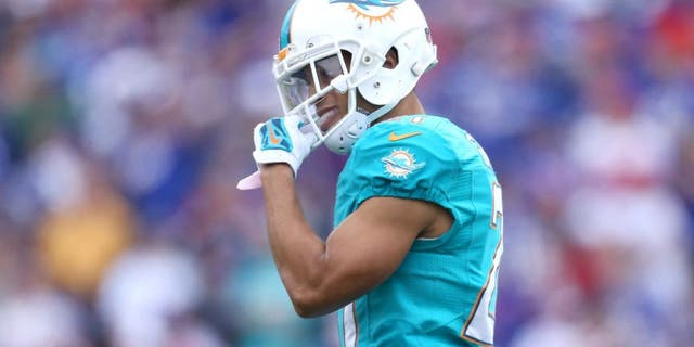 ORCHARD PARK, NY - SEPTEMBER 14: Brent Grimes #21 of the Miami Dolphins during NFL game action against the Buffalo Bills at Ralph Wilson Stadium on September 14, 2014 in Orchard Park, New York. (Photo by Tom Szczerbowski/Getty Images)