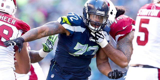 Nov 23, 2014; Seattle, WA, USA; Seattle Seahawks defensive end Michael Bennett (72) rushes the passer against the Arizona Cardinals during the second quarter at CenturyLink Field. Mandatory Credit: Joe Nicholson-USA TODAY Sports