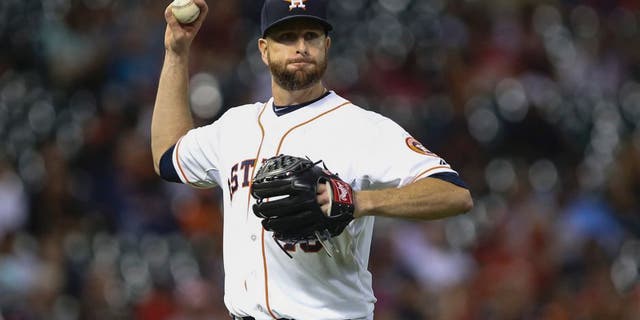 Apr 8, 2015; Houston, TX, USA; Houston Astros starting pitcher Scott Feldman (46) throws out a runner at first base during the fifth inning against the Cleveland Indians at Minute Maid Park. Mandatory Credit: Troy Taormina-USA TODAY Sports