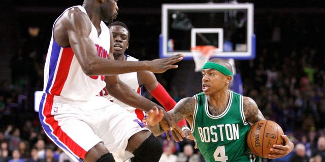 Apr 8, 2015; Auburn Hills, MI, USA; Boston Celtics guard Isaiah Thomas (4) dribbles the ball as Detroit Pistons center Joel Anthony (50) and guard Reggie Jackson (1) defend during the second quarter at The Palace of Auburn Hills. The Celtics won 113-103. Mandatory Credit: Raj Mehta-USA TODAY Sports