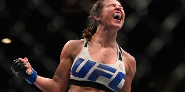 Miesha Tate celebrates after defeating Holly Holm during the UFC 196 event inside MGM Grand Garden Arena on March 5, 2016 in Las Vegas, Nevada. (Photo by Jeff Bottari/Zuffa LLC/Zuffa LLC via Getty Images)