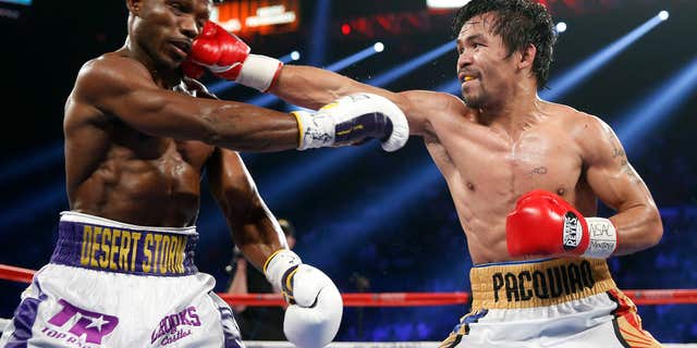 Manny Pacquiao, right, of the Philippines, hits Timothy Bradley during their WBO welterweight title boxing bout Saturday, April 9, 2016, in Las Vegas.
