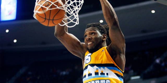 Apr 2, 2014; Denver, CO, USA; Denver Nuggets forward Kenneth Faried (35) dunks the ball during the second half against the New Orleans Pelicans at Pepsi Center. The Nuggets won 137-107. Mandatory Credit: Chris Humphreys-USA TODAY Sports