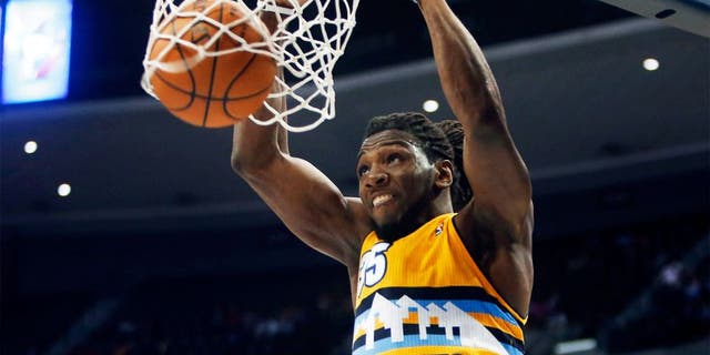 Apr 2, 2014; Denver, CO, USA; Denver Nuggets forward Kenneth Faried (35) dunks the ball during the second half against the New Orleans Pelicans at Pepsi Center. The Nuggets won 137-107. Mandatory Credit: Chris Humphreys-USA TODAY Sports