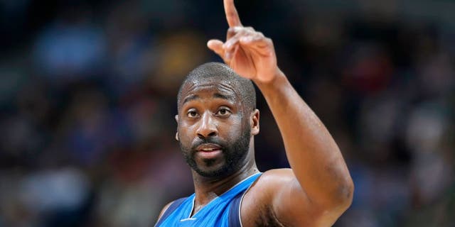 Dallas Mavericks guard Raymond Felton gestures after hitting a basket against the Denver Nuggets in the third quarter of an NBA basketball game Friday, April 10, 2015, in Denver. Dallas won 144-143 in two overtimes. Felton ended up scoring the winning basket. (AP Photo/David Zalubowski)