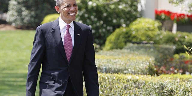 April 11: President Obama smiles as he walks to meet students from Altona Middle School in Longmont, Colo., on the South Portico of the White House in Washington.