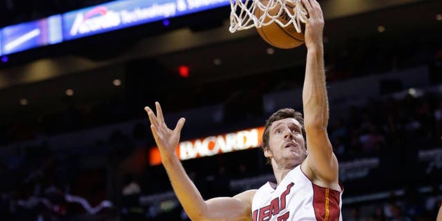 Miami Heat guard Goran Dragic (7) of Slovenia, goes up for a shot during the first half of an NBA basketball game against the Toronto Raptors, Saturday, April 11, 2015, in Miami. (AP Photo/Wilfredo Lee)