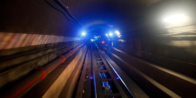 In this April 1, 2010 photo, the tunnel connecting the Bowling Green station in Manhattan to the Borough Hall station in Brooklyn on the 4 train line is seen in New York. (AP Photo/Mary Altaffer)