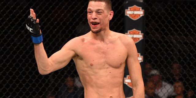 ORLANDO, FL - DECEMBER 19: Nate Diaz taunts Michael Johnson in their lightweight bout during the UFC Fight Night event at the Amway Center on December 19, 2015 in Orlando, Florida. (Photo by Josh Hedges/Zuffa LLC/Zuffa LLC via Getty Images)