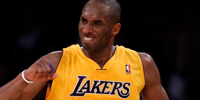 April 12: Los Angeles Lakers' Kobe Bryant celebrates after making a three-point basket against the San Antonio Spurs during the second half of an NBA basketball game in Los Angeles.