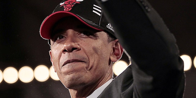 April 14: President Obama wears Chicago Bulls basketball cap after delivering remarks at a DNC fundraiser at Navy Pier in Chicago.