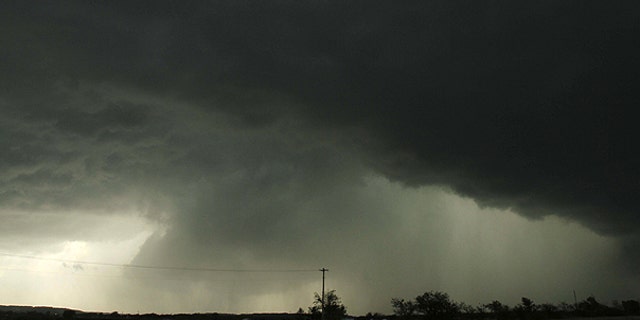 April 14: Storm clouds pass north of Kiefer, Okla. Numerous severe thunderstorms with large hail and winds gusting to 70 mph were reported with many of the storms moving through southeastern Oklahoma.