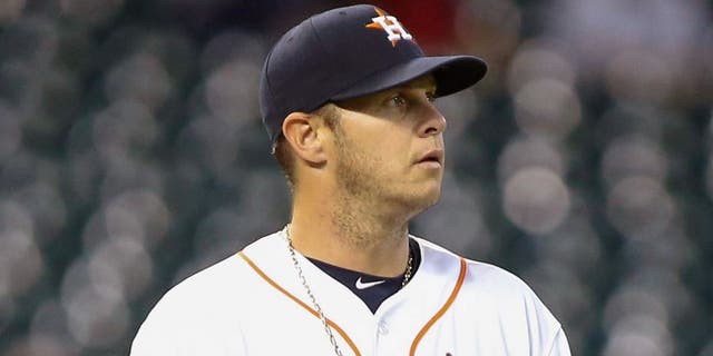 Apr 14, 2015; Houston, TX, USA; Houston Astros starting pitcher Brad Peacock (41) reacts after a play during the second inning against the Oakland Athletics at Minute Maid Park. Mandatory Credit: Troy Taormina-USA TODAY Sports